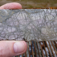 Massive anhydrite-gypsum vein with chalcopyrite-pyrite