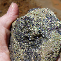 Massive enargite (black)-pyrite (brass) high-sulphidation mineralization